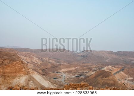 Horizontal Picture Of Mountainous Relief During Sunrise In Massada, Israel
