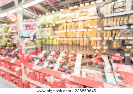 Blurred Wide Aisle Power Tool Combo Kits At Hardware Store In America