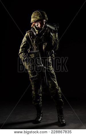 Portrait Of Armed Woman With Camouflage. Young Female Soldier Observe With Binoculars. Child Soldier
