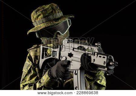 Portrait Of Armed Woman With Camouflage. Young Female Airsoft Sniper Observe With Firearm. Soldier W