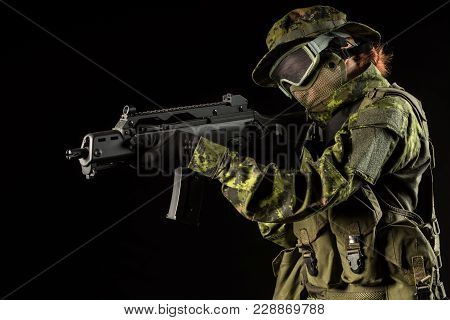 Portrait Of Armed Woman With Camouflage. Young Female Airsoft Sniper Observe With Firearm. Soldier W