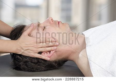 Physiotherapist, Chiropractor Assessing The Muscles On A Jaw. Osteopathy.