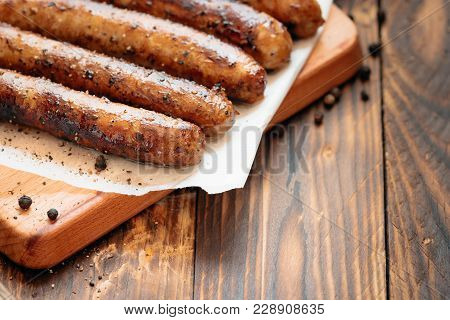 Pork Chipolata. Close-up View Of Fried Sausages. Meat Dish.