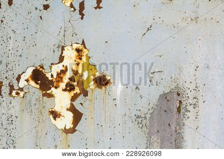 Abstract Background Texture Of Vertical Grungy Rusting Metal Plate With Peeling Paint And Extensive 