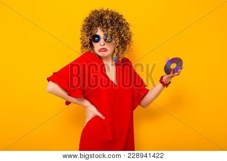 Attractive Woman With Curly Hair With Disc
