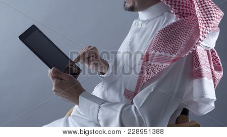 Saudi Arabian Man Hands Holding Tablet