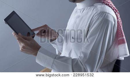 Saudi Arabian Man Hands Holding Tablet