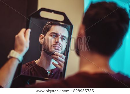 Man Looks At His Beard And Thought About Shaving