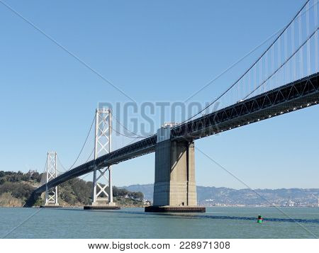 San Francisco Side Of Bay Bridge With Oakland In The Distance On A Clear Day.