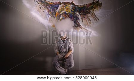 Artist Designer Draws An Eagle On The Wall. Craftsman Decorator Paints A Picture With Acrylic Oil Co