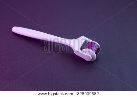 Mezoroller, Dermaroller, Mesotherapy Skin Tool. A Mesoroller With A White Handle And A Pink Rabbit O