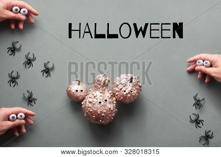 Creative Halloween Flat Lay On Grey Paper Background With Copy-space. Frame Made Of Hands In Black M