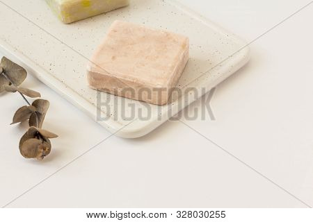Soap From Soy Wax With Vsprig Of Eucalyptus On A White Marble Boardwhite Background. Natural Cosmeti