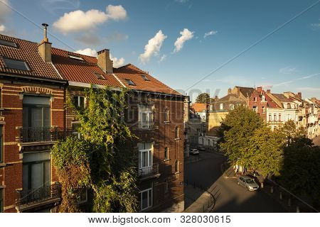 Beautiful Brick House Covered In Luscious Vegetation In Central Brussels