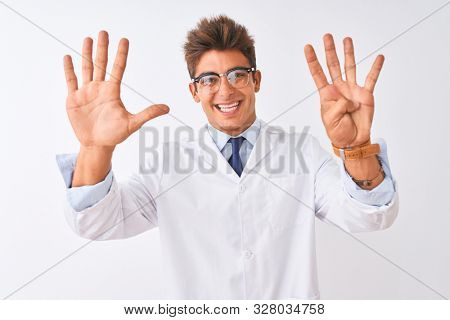 Young handsome sciencist man wearing glasses and coat over isolated white background showing and pointing up with fingers number nine while smiling confident and happy.