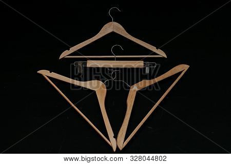 Three Hangers For Clothes On Black Vintage