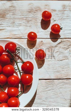 Cherry Tomatoes On Wooden Table Background With Copy Space