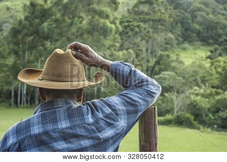 Ibitipoca, Lima Duarte, Minas Gerais, Brazil - March 13, 2016: Cowboy With Traditional Hat Leaning O