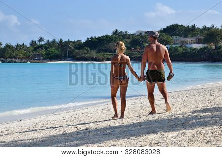 Kendwa, Zanzibar - October 3, 2019: Kendwa Resort, Beautiful Beach With White Sand And Tourist Coupl