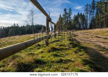 Hiking Trail In Mountains With Wooden Fence Along The Path, Autumn Nature, Alpine Mountain Landscape