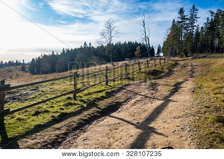 Hiking Trail In Mountains With Wooden Fence Along The Path, Autumn Nature, Alpine Mountain Landscape