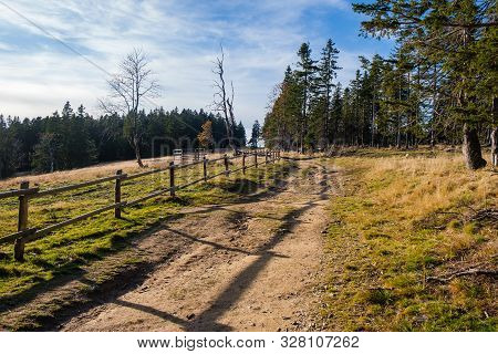 Hiking Trail In Mountains With Wooden Fence Along The Path, Autumn Nature, Alpine Mountain Landscape