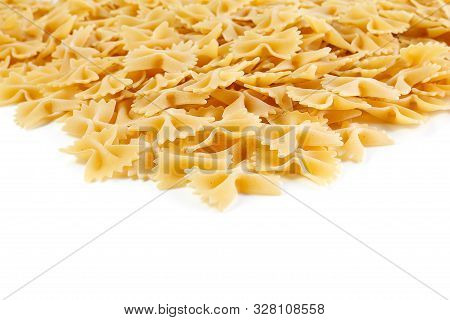 A Variety Of Types And Shapes Of Italian Pasta. Dry Pasta Bows Farfalle.  Heap Of Bow Tie Macaroni I