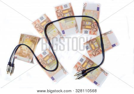 Audiophile Concept. Stereo Audio Cable On Banknotes.