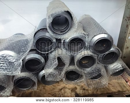 Packed In Transparent Film Bellows On The Warehouse Table