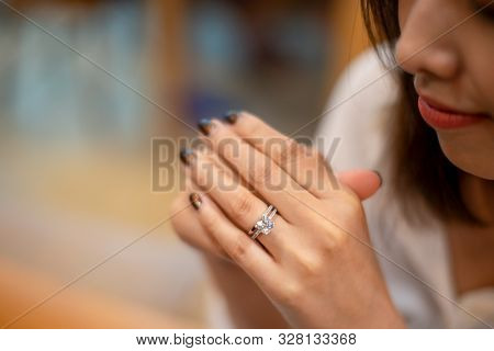 Close Up Of An Elegant Diamond Rings On Woman Finger,(soft And Sellective Focus)
