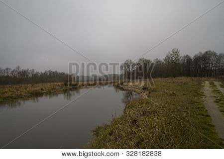 Beautiful Polish Autumn Cold Gray Cloudy November Landscape Of Podlasie With The River Bug