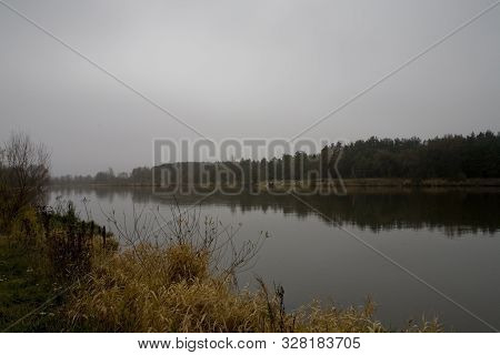 Beautiful Polish Autumn Cold Gray Cloudy November Landscape Of Podlasie With The River Bug