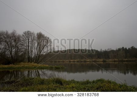 Beautiful Polish Autumn Cold Gray Cloudy November Landscape Of Podlasie With The River Bug