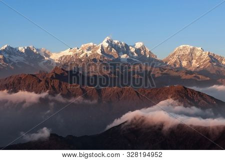 Breathtaking Mountain Landscape With Beautifully Floating Clouds On The Sunrise. Himalayas Landscape