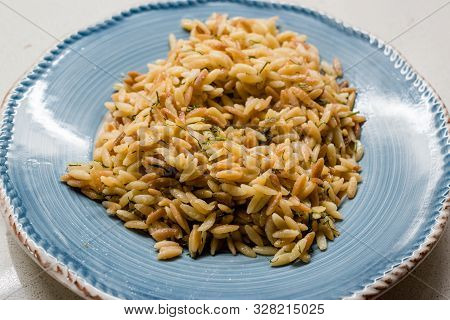 Turkish Cooked Orzo Pasta In Plate / Pilav Or Pilaf. Organic Food. Traditional Food.