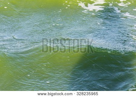 Green Water In The Sea Lagoon. The Lagoon Is A Bay Separated From The Sea. The Color Of Water Is Due