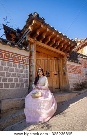 Korean Girl With Hanbok,portrait Asian Women Wearing Hanbok At The Traditional Style Houses Of Bukch