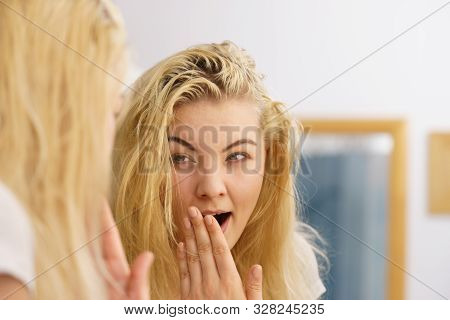 Young Blonde Female Feeling Dull And Tired After Waking Up. Woman Yawning Being Sleepy In Bathroom.