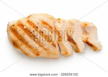 Partially Sliced Grilled Chicken Breast With Grill Marks, Ground Black Pepper And Salt Isolated On W