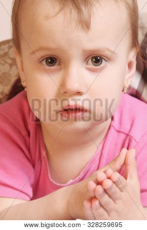 Children's Anxiety Concept. Portrait Of Cule Little Baby Girl.