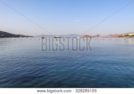 Beautiful Sunrise On The Aegean Sea With Islands, Mountains And Boats