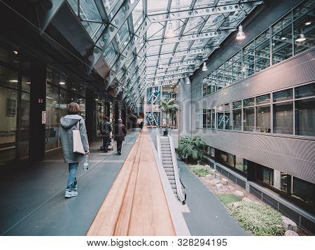 Strasbourg, France - Nov 23, 2017: Rear View Of Patients Woman Walking Inside The Nhc Nouvel Hopital