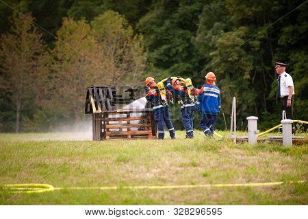 Germany, Niederstetten, Baden Wurttemberg. September 2019 Young Firefighters In Training With Fire H