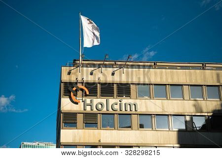 Hamburg, Germany - Mar 2018: Front View Of Logotype Insignia On The Headquarter Of Holcim Swiss-base