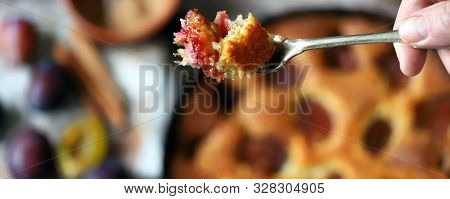 Selective Focus. Slice Of Plum Pie On A Fork. Homemade American Plum Pie. Macro.