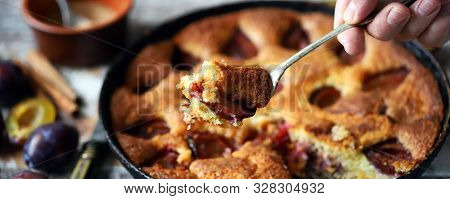 Selective Focus. Slice Of Plum Pie On A Fork. Homemade American Plum Pie. Macro.