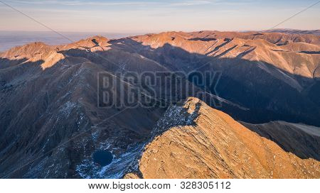 Sunset In Caltun Lake. Fagaras Mountains, Romania