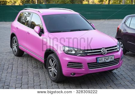 Kharkov, Ukraine - September 24, 2019: Volkswagen Touareg Hybrid Nf In Magenta Purple Color On Parki
