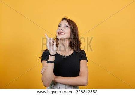 Gorgeous Girl Wondering About Something Good As She Looks Happy. She Is Building Castles In The Air 