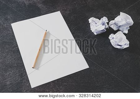 Overcoming Creative Block And Lack Of Productivity Concept, Sheet And Pencil Next To Group Of Scrunc